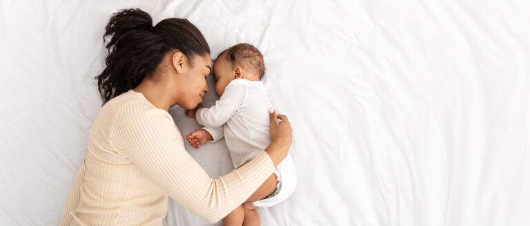 woman with baby sleeping